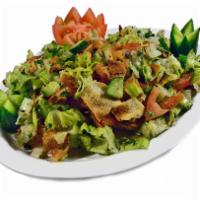 Fatoush · Romaine lettuce, tomatoes, cucumbers, onions and toasted pita bread tossed in lemon juice, o...