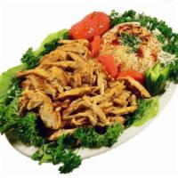 Chicken Shawarma Entree · Marinated tender chicken breast grilled, shredded and served with garlic sauce. Served with ...