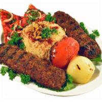 Kafta Kabob (Lula) Entree · A mixture of lean ground beef, parsley and onions grilled to perfection. Served with hummus,...