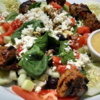 Baby Spinach Salad · Fresh baby spinach tossed with roasted walnuts, feta cheese, black olives, tomatoes, white d...