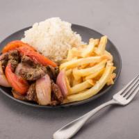 Lomo Saltado · Sauteed beef tenderloin strips, onions and tomatoes served with fries and rice.