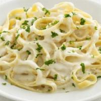 Fettuccine Alfredo · Fettuccine in creamy Alfredo sauce with cheese.