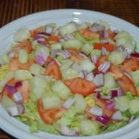 Garden Salad · Iceberg lettuce, tomato, red onion and cucumbers.