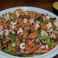 Spring Salad · Assorted mixed greens. Tomatoes, cucumbers, red onions, candied walnuts and cranberry-infuse...