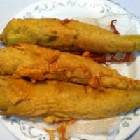 Mirchi Pakora · Banana peppers dipped in batter and deep fried.