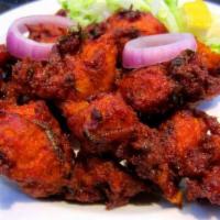 Chicken 65 · Popular Hydrabadi chicken cooked in spicy tangy sauce.