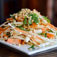 Thai Cabbage Salad · Cabbage, carrot, cilantro, cucumber, peanuts and thai vinaigrette. Vegan