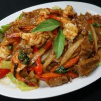 42. Drunken Noodles · Stir fried flat noodles with onions, bell peppers and basil in chili sauce. Spicy.