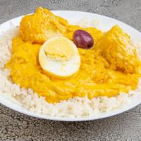 Aji de Gallina · Shredded chicken in a traditional aji Amarillo and walnuts creamy sauce served with a dash o...