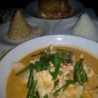 Panang Curry · Blended taste of sweet, medium spice and little salty curry with string beans and lime leaf.
