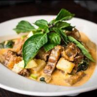 Royal Pork Belly Red Curry · Crispy pork belly, green apple, pineapple, basil and Thai red curry. Spicy.