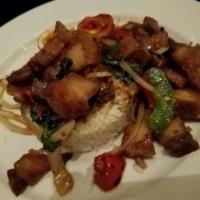 Kao Pao Moo Krob · Crispy pork belly, Thai chili, holy basil, garlic, son-in-law egg, and fish sauce chili dip....