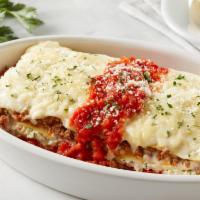 Lasagna · Oven-baked pasta layered with authentic Bolognese meat sauce, ricotta & mozzarella