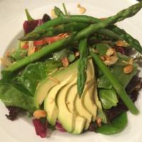 Julie’s Salad · A generous portion Asparagus, avocado, Roma tomatoes and artichoke hearts with toasted almon...