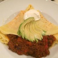 Inigo Montoya Crepe · Spanish chorizo sauteed with roasted red bell peppers and salsa. Served with avocado and sou...