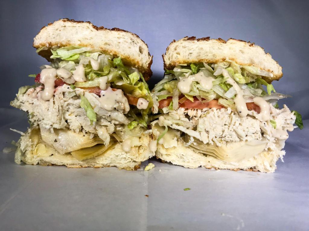 30. Backstabber Sandwich · Halal chicken, artichoke hearts, Caesar dressing and provolone cheese.