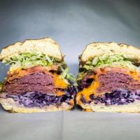 91. Paul Reubens · Pastrami, purple slaw, French dressing and Swiss. Served with dirty sauce, lettuce and tomato.