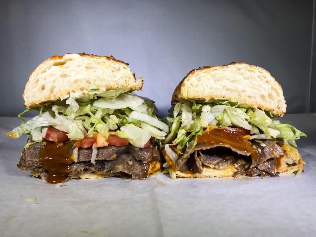 240. Madison Bumgarner Sandwich · Steak, Ike's yellow BBQ, Sriracha, pepper jack, and American. Served with dirty sauce, lettuce, and tomato.