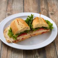 33. Cajun Sandwich · Provolone, roasted red bell peppers, lettuce, tomato and lite mayo on an Italian sesame roll.