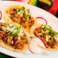 Taquitos de Suadero (3 Taquitos) · Three Taquitos with beef, topped with cilantro and onions.