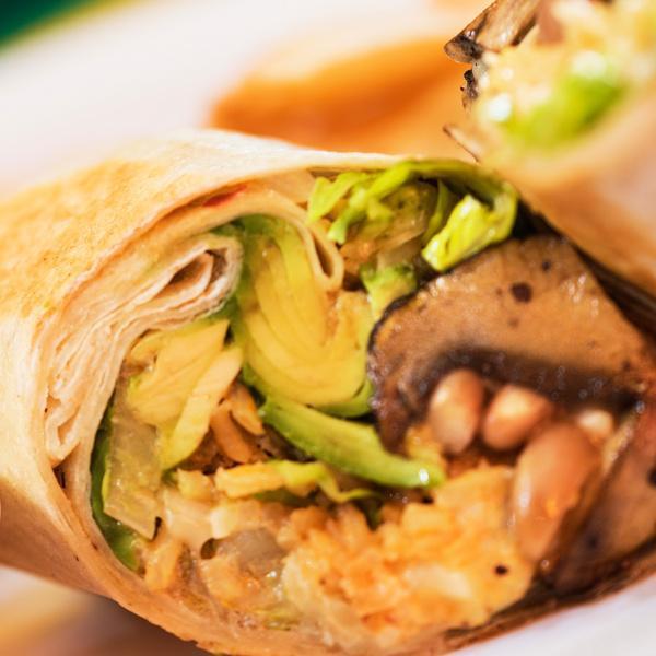 Mushrooms and Avocado Burrito · Mexican rice, pinto beans, lettuce, monterey jack cheese, sour cream, and salsa roja wrapped in a warm flour tortilla. Served chips and fresh salsa.

