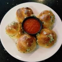 Garlic Knots · 3 large sized garlic knots served with a side of our homemade marinara sauce