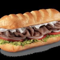 Premium Roast Beef Sub · Roast beef and provolone. Served with mayo, lettuce, tomato, onion, deli mustard, and a pick...