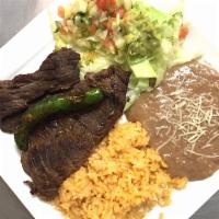 Carne Asada Plate · Grilled beef. Mexican rice and bean, salad with guacamole, pico de gallo and side of corn to...