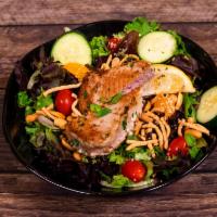 Asian Tuna Salad · Baby mixed greens, crispy chow mein noodles, mandarin oranges, sesame seeds, cucumbers, pean...