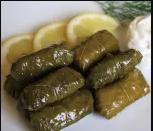 Dolmades · Vine leaves stuffed with basmati rice, herbs and spices. Vegan and gluten free.