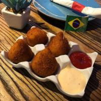 Coxinha de Frango (6) · Homemade Brazilian style chicken croquettes. Served with Catupiry cheese.