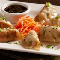 Chicken Pot Stickers · Pan-seared dumplings, chicken, ginger, garlic, yellow chives, green onions, soy ginger sauce...