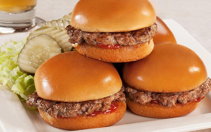 Sliders · Four beef patties, fluffy mini buns, grilled onions, lettuce, dill pickles, ketchup