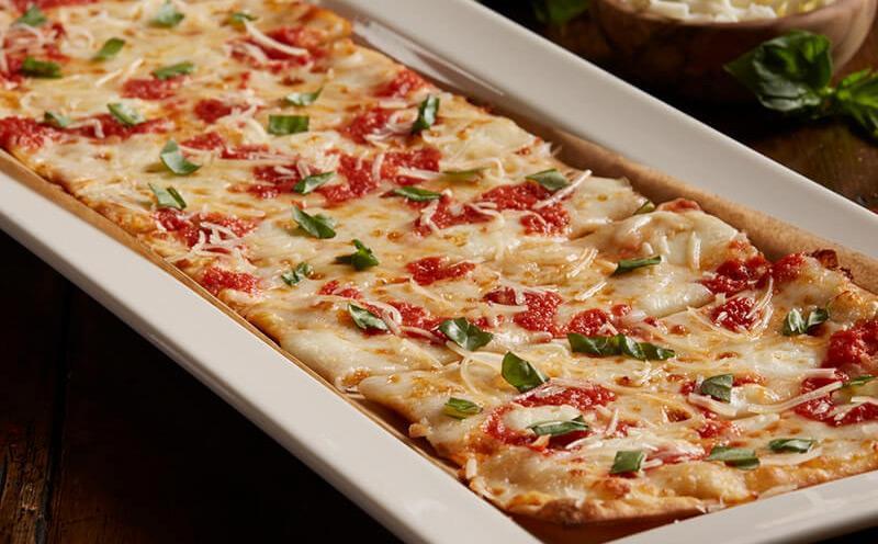 Margherita Fresca Flatbread · Fresh mozzarella, zesty pizza sauce, fresh basil, Parmesan cheese