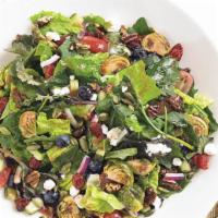 Kale And Roasted Brussels Sprouts Salad · Baby kale, roasted brussels sprouts, romaine, fresh blueberries, sweet red grapes, dried cra...