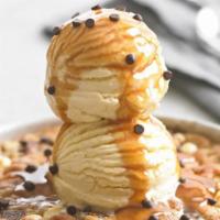 Salted Caramel Pizookie® · Warm caramel cookie with sweet almond toffee, crunchy pretzel bites, white + Ghirardelli® da...