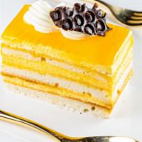 Moksha Mango · the ultimate mango cake with amazing flavor and texture, topped with fluffy, flavorful mango...