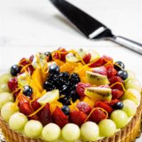 Fresh Fruit Tart · A sweet, buttery short dough shell filled with our homemade vanilla custard and a thin layer...