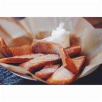 Cinnamon-Sugar Pita Strips · Covered in cinnamon brown sugar, served with funfetti frosting on the side.