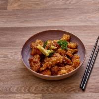 P8. General Tao's Chicken · Lightly breaded chicken, broccoli in sweet and spicy glazed sauce Hot and spicy.