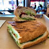 The Carlos Chicken Pesto Panini · Chicken breast, Swiss cheese, roasted red pepper and pesto on a grilled sandwich roll.
