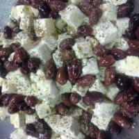 Feta and Olives · Greek feta cheese and Kalamata olives, topped with oregano and extra virgin olive oil.