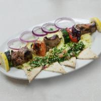 Lamb Kebab · Chunk of lamb marinated with fresh herbs, then grilled with onions, green peppers and mushro...