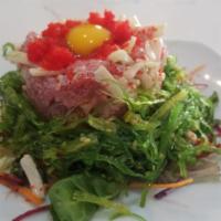 Tuna Tartare · Tuna, cucumber, seaweed salad, masago, quail egg and special sauce. Raw.