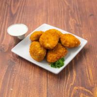 Jalapeno Poppers · Hot and spicy jalapenos stuffed with a cream cheese filling served with cool ranch dressing.
