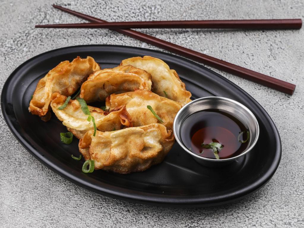 Gyoza · Fried or steamed chicken and pork and vegetable dumplings.