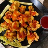 Cauliflower wings · Battered with sun-dried chickpea flour and rice flour, fried and coated with BBQ sauce. 8 pcs