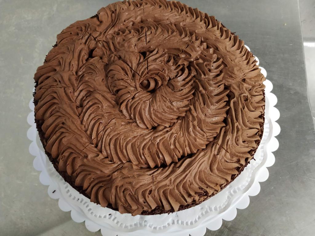 Old Fashioned Chocolate cake · Chocolate cake for that chocolate lover, chocolate on chocolate. Price per slice.
