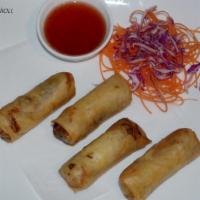 A1. Spring Roll · Stuffed with glass noodles, mushrooms, cabbage, carrots and celery with plum sauce.