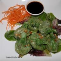 A4. Steamed Vegetable Dumplings · Stuffed with mixed vegetables and served with house soy sauce.